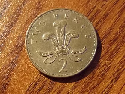 Close-up of a British two pence coin.