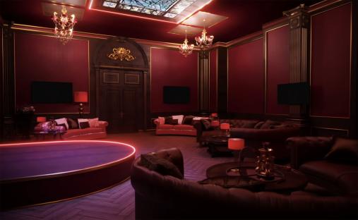 a living room with red walls and black furniture