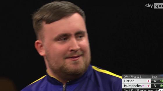 Close-up of a man, possibly a darts player, with a scoreboard showing Littler 4-3 Humphries.