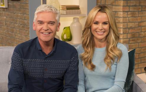 Amanda Holden and Phillip Schofield on a TV show.