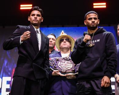 Ryan Garcia and Rolando Romero posing at a press conference.