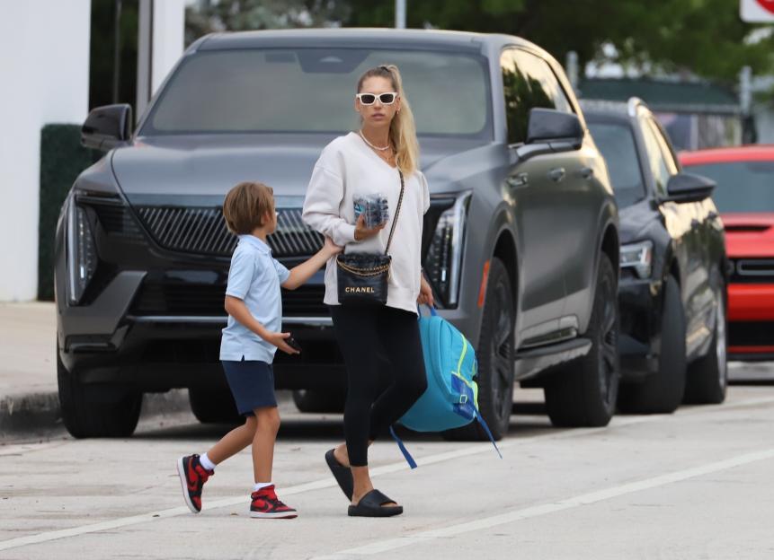 Anna Kournikova walks next to her son Nicholas.
