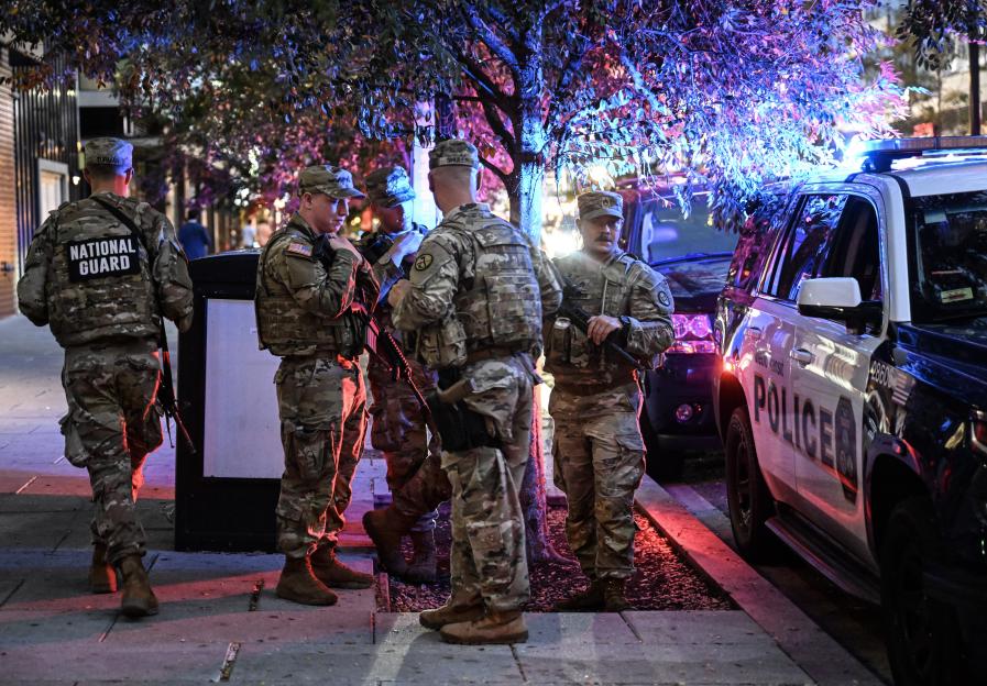 National Guard troops and police officers at a protest.