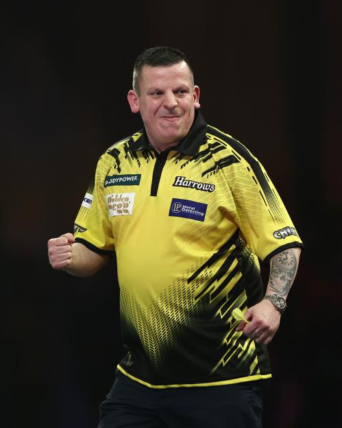 Dave Chisnall of England celebrating during a darts match.