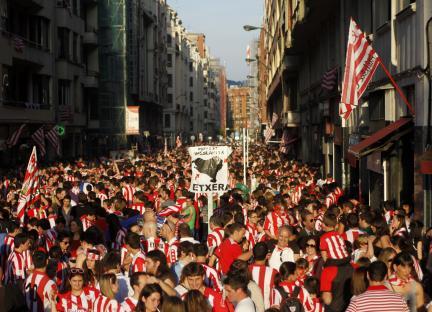 Athletic Bilbao fans celebrating in the street.