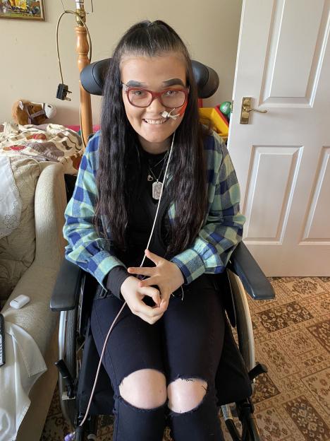 Young woman in a wheelchair.