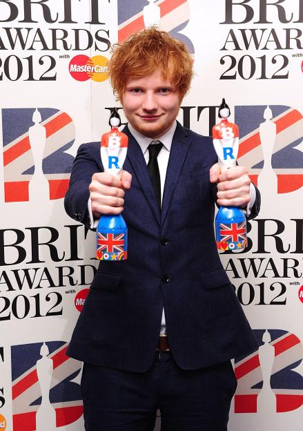 Ed Sheeran holding his British Breakthrough Act award and Best Male Solo Artist award at the 2012 Brit Awards.