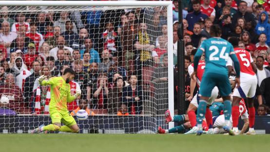 Evanilson of Bournemouth scoring a goal during a Premier League match.