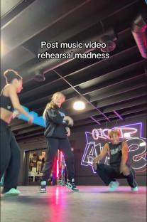 Three dancers rehearsing post-music video.
