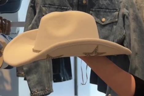 White cowboy hat with star accents and denim jackets.