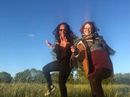 Two women enjoying a picnic in a park.