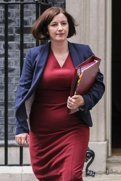 Bridget Phillipson, Education Secretary, walking with a portfolio.