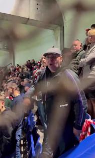 A fan shouting racial slurs at a soccer game.