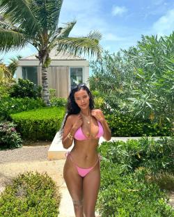 Maya Jama in a pink bikini on holiday.
