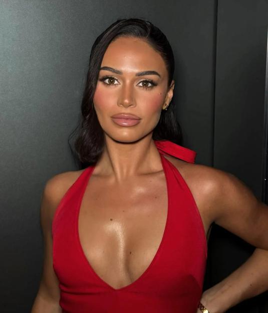 Olivia Hawkins in a red halter top.