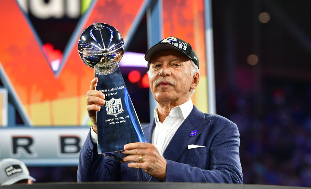 Stan Kroenke holding the Vince Lombardi Trophy after the Los Angeles Rams won Super Bowl LVI.