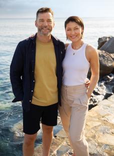 Emma Willis and a man by the ocean.