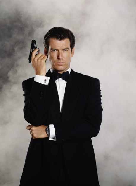 Pierce Brosnan as James Bond holding a Walther PPK.