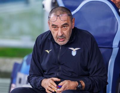 Maurizio Sarri, Lazio coach, sits on a bench.