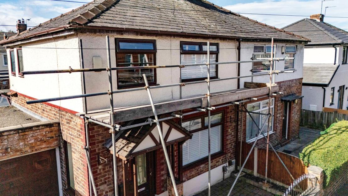House with scaffolding around the front.
