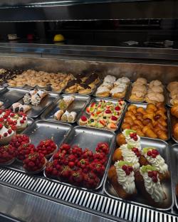 Assortment of pastries in a display case.