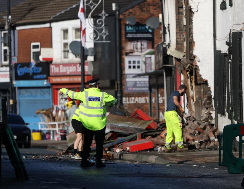 Town centre building collapses after car smashes into takeaway during police chase before man in his 30s arrested
