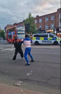 Moment thugs use huge STICKS & baseball bats as weapons as brawl erupts on busy high street in broad daylight