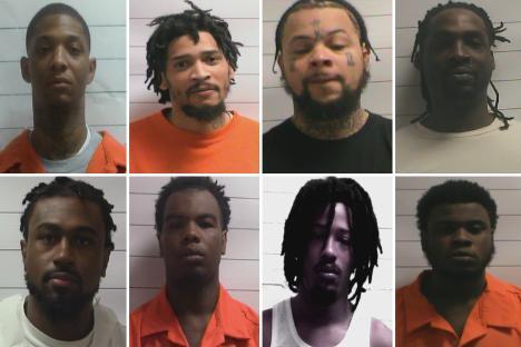 Composite image of eight inmate mugshots.