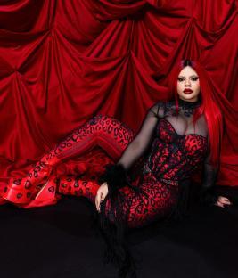 Miriana Conte, representing Malta, in a red and black leopard print outfit.