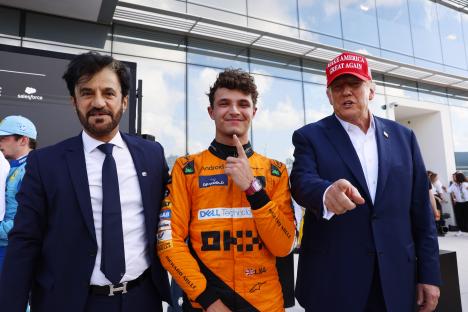 Donald Trump speaking with McLaren CEO Zak Brown in the McLaren garage.