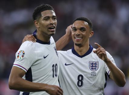 Jude Bellingham and Trent Alexander-Arnold celebrating an England goal.