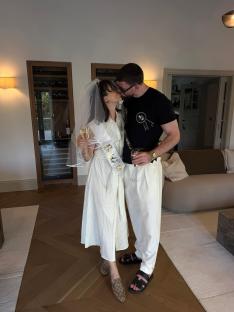 Couple kissing at a bridal shower.
