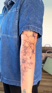 Floral tattoo on a person's arm.
