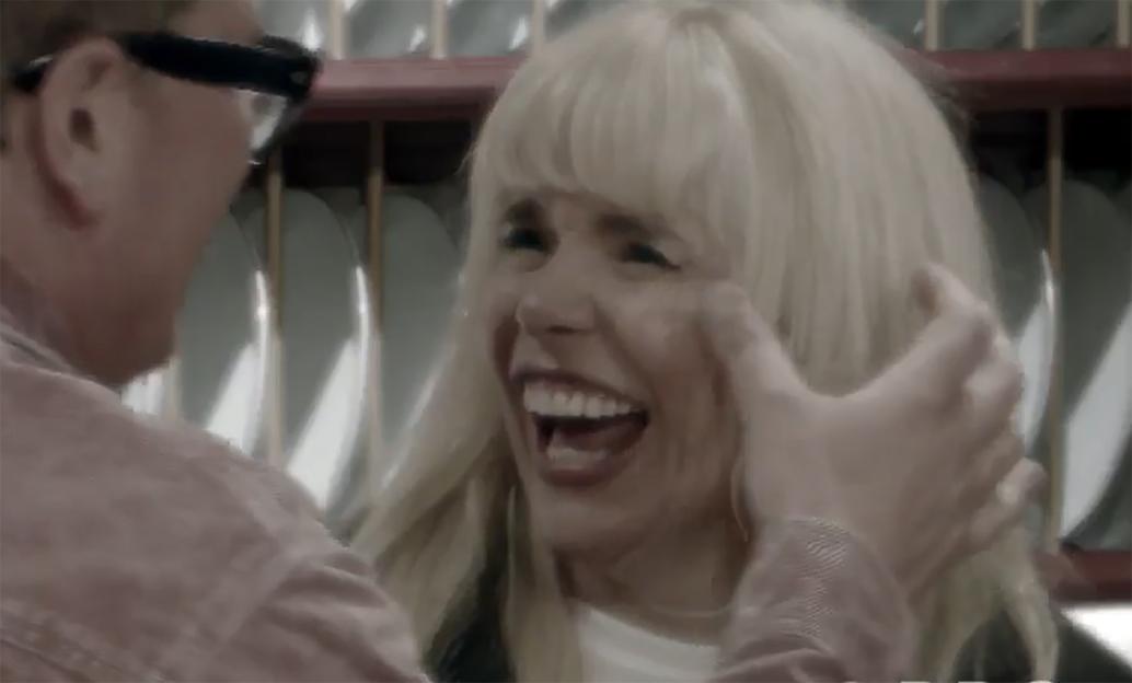 Alan Carr touching Paloma Faith's face to poison her on Celebrity Traitors.