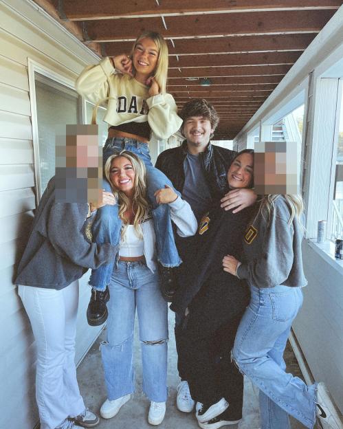 Photo of a group of young adults; some faces are blurred.