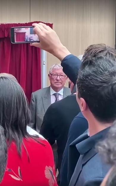Sir Alex Ferguson viewed on a phone screen.