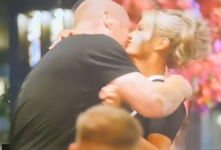 Sean Dyche and Kerry Katona embracing.