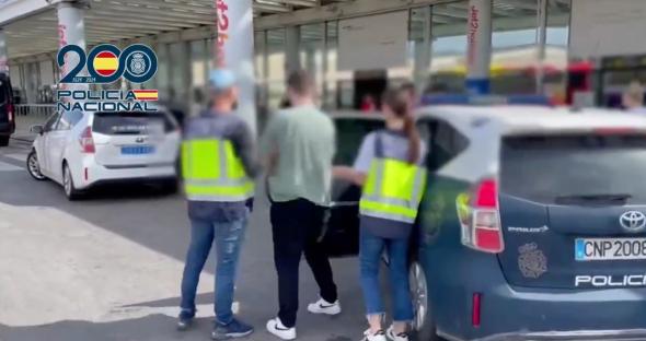Footage of Spanish police arresting a suspect.