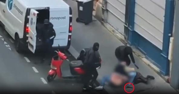 Footage of three masked men forcing a woman into a van.