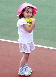 Photo of Madeleine McCann holding tennis balls.