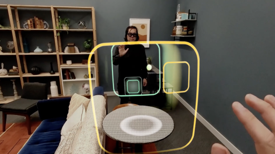 Person using augmented reality interface in a living room.