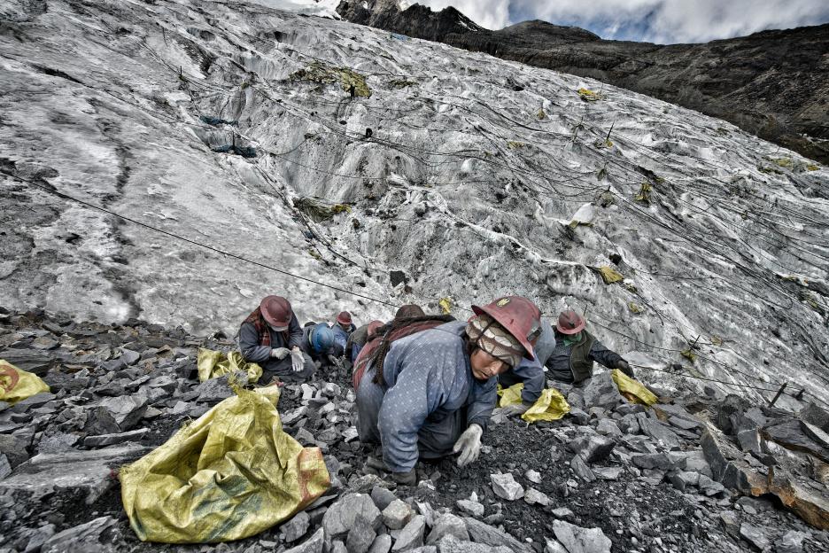 Women panning for gold in the Peruvian Andes.