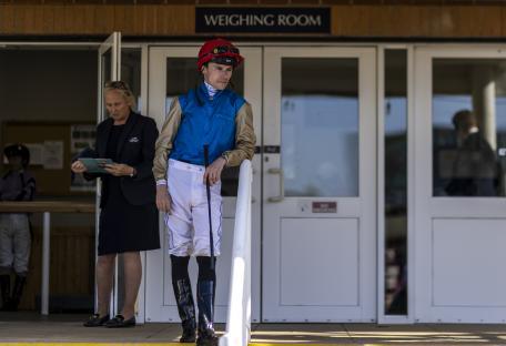 Jockey Kieran Shoemark outside the weighing room at Newbury Racecourse.