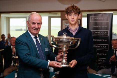 Golf Ireland President presenting a trophy to the winner of the West of Ireland Men's Amateur Open.