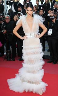 Kendall Jenner at the Cannes Film Festival wearing a sheer white tulle gown.
