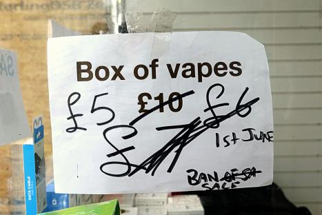 Handwritten sign advertising a vape sale before a ban.