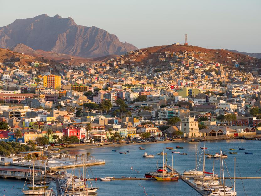 Aerial view of Mindelo, Cape Verde, showing the city, harbor, and boats.