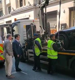 Michael McIntyre's car being towed away.