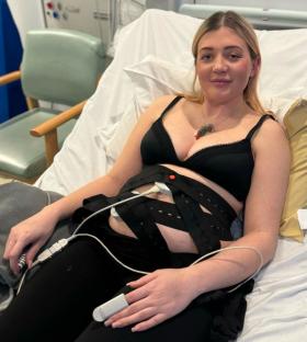 Woman in hospital bed after giving birth while in a coma.