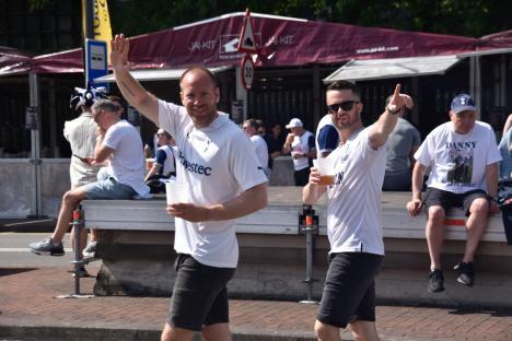 Two Tottenham Hotspur fans drinking beer before a UEFA Europa League Final match.